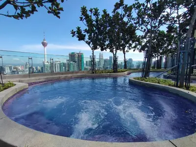a lap pool on the roof of a building with trees at The Robertson Bukit Bintang by TALKS COLLECTION in Kuala Lumpur