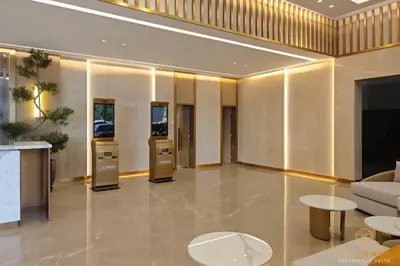 a lobby with a couch and a table at Armani Residence Kuala Lumpur in Kuala Lumpur