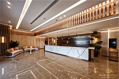 a lobby of a hotel with a reception desk at Armani Residence Kuala Lumpur in Kuala Lumpur