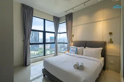a bedroom with a bed and a large window at Arte Mont Kiara Luxe Suites by Dream'Inn in Kuala Lumpur