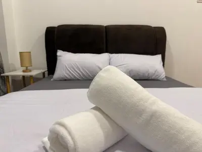 a rolled up towel on a bed in a bedroom at Luxury Affordable at Arte Plus 2BR Near KLCC with WiFi in Kuala Lumpur