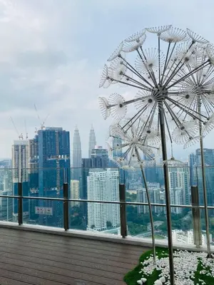 a ferris wheel on the top of a building at Agile Sky Pavilion Homestay Bukit Bintang KL in Kuala Lumpur