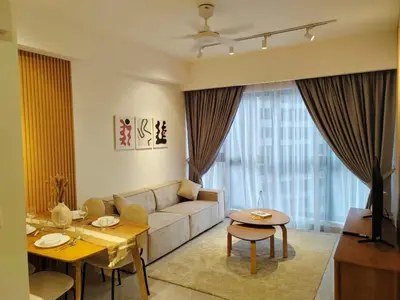 a living room with a couch and a table at Agile Sky Pavilion Homestay Bukit Bintang KL in Kuala Lumpur
