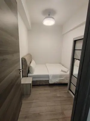 a small bedroom with a bed and a mirror at Agile Sky Pavilion Homestay Bukit Bintang KL in Kuala Lumpur