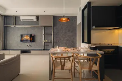 a kitchen with a table and chairs in a kitchen at Novo Ampang 2 Bedrooms KLCC view in Kuala Lumpur