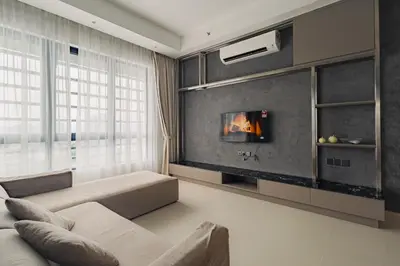 a living room with a couch and a fireplace at Novo Ampang 2 Bedrooms KLCC view in Kuala Lumpur