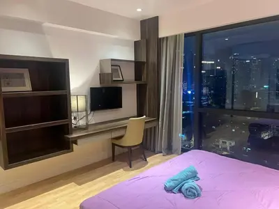 a bedroom with a bed and a desk and a window at D Majestic hosted by Super kk in Kuala Lumpur