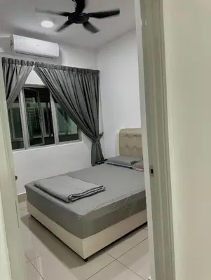 a bedroom with a bed and a ceiling fan at ESU Home Ventures in Kuala Lumpur