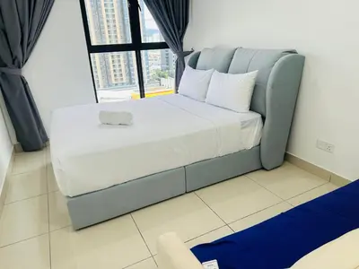 a large bed in a room with a large window at Trion Dream house KL City in Kuala Lumpur