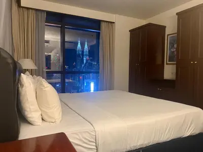 a hotel room with a bed and a window at Times Square Kuala Lumpur by Willow Trip in Kuala Lumpur
