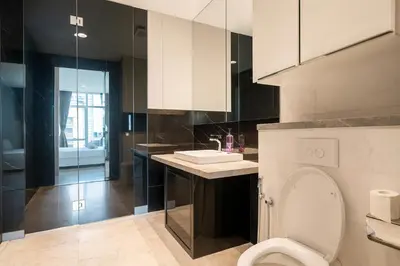 a bathroom with a toilet and a sink at The Platinum Kuala Lumpur by MAHA in Kuala Lumpur