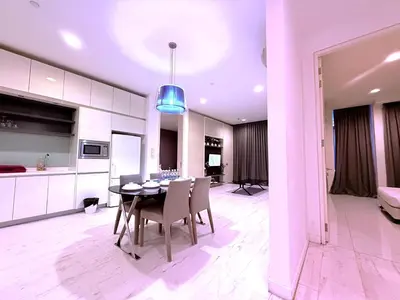 a kitchen and dining room with a table and chairs at The Platinum Kuala Lumpur by MAHA in Kuala Lumpur