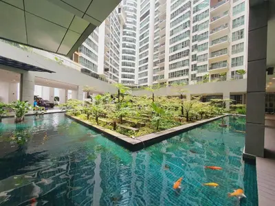 a large pool of water with fish in a building at The regalia KLCC panorama view in Kuala Lumpur