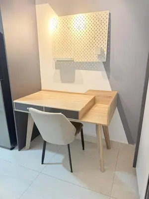 a desk in a room with a chair and a table at Colony Suites KL by Sopping Centre in Kuala Lumpur