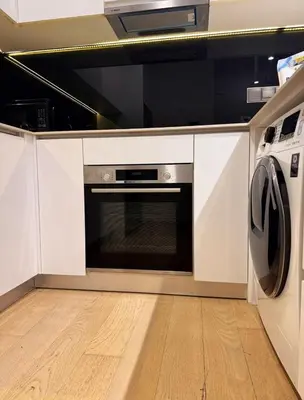 a kitchen with a microwave and a dishwasher at luxury One Bedroom KLCC in Kuala Lumpur