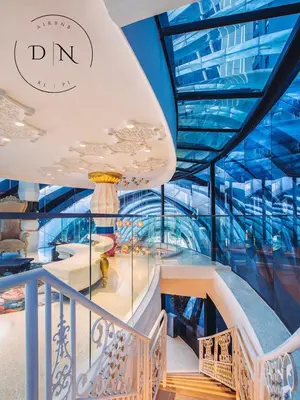 a staircase in a building with a glass ceiling at ARTE Mont Kiara Modern Sanctuary Jacuzzi in Kuala Lumpur
