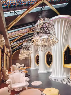 a lobby with chairs and a chandelier at ARTE Mont Kiara Modern Sanctuary Jacuzzi in Kuala Lumpur