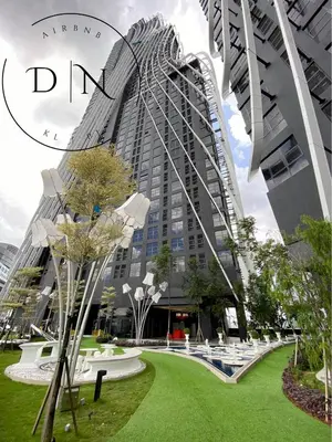 a tall building with a green park in front of it at ARTE Mont Kiara Modern Sanctuary Jacuzzi in Kuala Lumpur