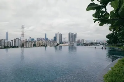 a large body of water with a city in the background at Cozy Home to explore KL City KLCC TRX Bkt Bintang in Kuala Lumpur
