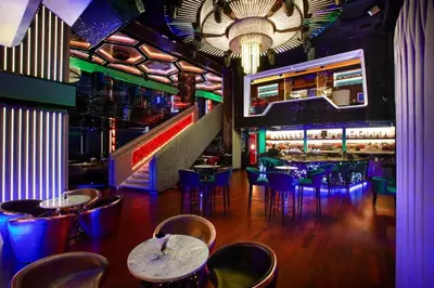 a restaurant with tables and chairs and a bar at Platinum Suites KLCC by Dream'Inn in Kuala Lumpur