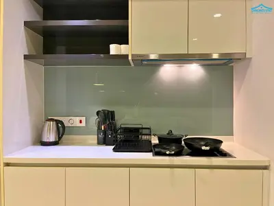 a kitchen counter with two pots and pans on a stove at Platinum Suites KLCC by Dream'Inn in Kuala Lumpur