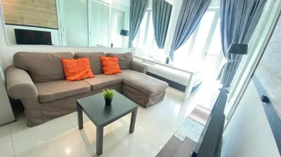 a living room with a couch and a table at 3-10mins to klcc -pavilion -premium studio 2-4pax in Kuala Lumpur