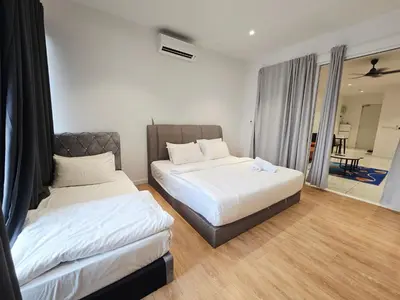 a bedroom with two beds and a balcony at Quill Residence Queen House in Kuala Lumpur