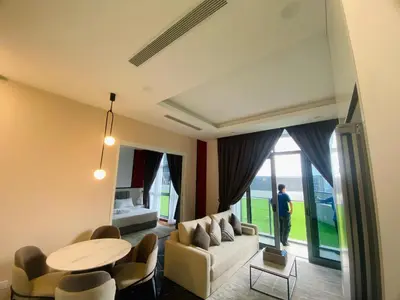 a living room with a couch and a table at Royce Residence KLCC by ABM Unique in Kuala Lumpur