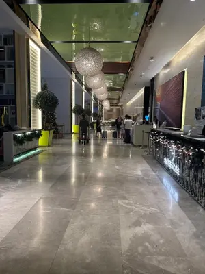 a lobby of a building with people walking in it at The Platinum Galaxy Suites KLCC in Kuala Lumpur