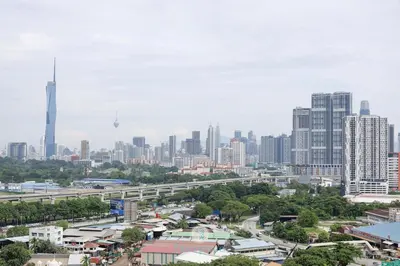 a city skyline with tall buildings and a freeway at Chan Sow Lin - Cozy 3B3B - 6 pax - F&B & Mart in Kuala Lumpur
