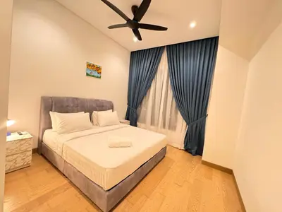 a bedroom with a bed and a ceiling fan at Lucentia Suties Rooftop pool by Lalaport KL in Kuala Lumpur