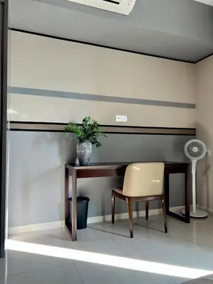 a desk and a chair in a room at Dorsett Hartamas - Luxury Studio with Bathtub in Kuala Lumpur