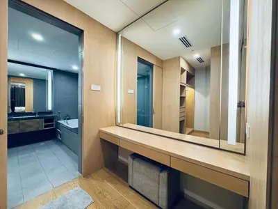 a bathroom with a large mirror and a sink at 188 suites Apartment with KLCC View by Vho'Z in Kuala Lumpur