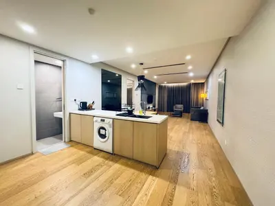 a large kitchen with a sink and a stove at 188 suites Apartment with KLCC View by Vho'Z in Kuala Lumpur