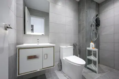 a bathroom with a toilet and a sink and a shower at Majestic Residence near KLCC Quill City 1 in Kuala Lumpur