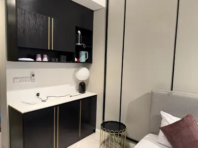 a bathroom with a desk and a chair in a room at Akson Residensi Axon Bukit Bintang by TaheeenS in Kuala Lumpur