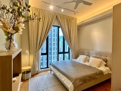 a bedroom with a bed and a large window at KL Sentral 16th Floor KL City View in Kuala Lumpur