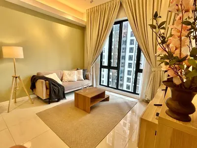 a living room with a couch and a large window at KL Sentral 16th Floor KL City View in Kuala Lumpur
