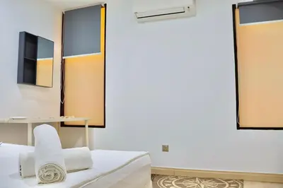 a room with a bed and two mirrors at 3BR at Holiday Place Kuala Lumpur 5 mins to KLCC & MRT in Kuala Lumpur