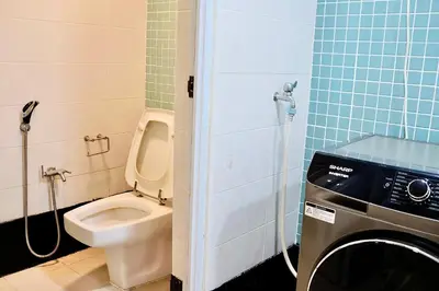 a bathroom with a toilet and a washing machine at 3BR at Holiday Place Kuala Lumpur 5 mins to KLCC & MRT in Kuala Lumpur