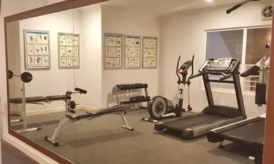 a gym with several exercise equipment in a room at 3BR at Holiday Place Kuala Lumpur 5 mins to KLCC & MRT in Kuala Lumpur