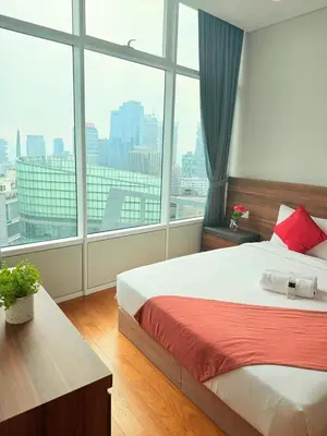 a bedroom with a bed and a large window at Sky Suites KLCC by TD Luxury Homestay in Kuala Lumpur