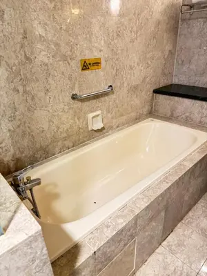 a large white bath tub in a bathroom at Services Star Apartment At Times Square KL in Kuala Lumpur
