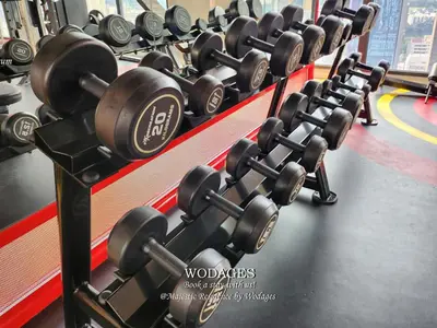 a row of dumbbells in a gym at Majestic Residence KL by Wodages in Kuala Lumpur