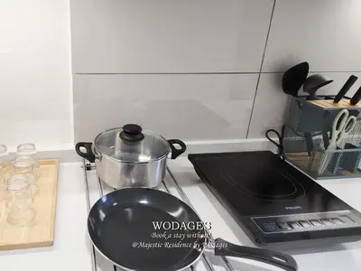 a pot sitting on top of a stove in a kitchen at Majestic Residence KL by Wodages in Kuala Lumpur