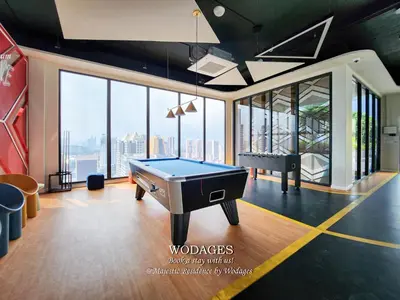 a billiard room with a pool table in the middle at Majestic Residence KL by Wodages in Kuala Lumpur