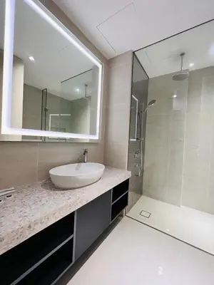 a bathroom with a sink and a mirror and a shower at Urban Starscape 50450, KL in Kuala Lumpur
