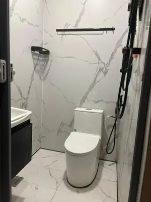 a bathroom with a toilet and a sink at KING HOSTEL by Global Inn in Kuala Lumpur