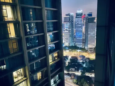 a view from a window of a city with tall buildings at Summer Suites KLCC by Vho'Z in Kuala Lumpur