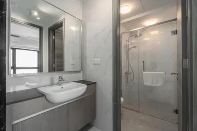 a white bathroom with a sink and a shower at Agile Bukit Bintang, 54th Floor Apt, Infinity Pool in Kuala Lumpur
